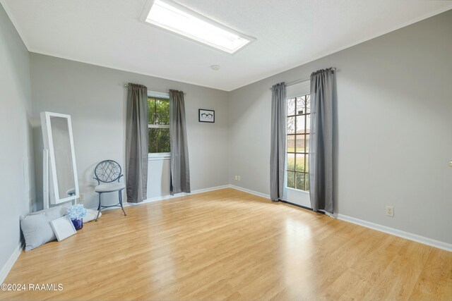 unfurnished room with light hardwood / wood-style flooring