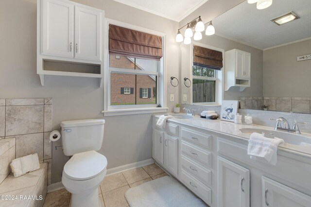 bathroom featuring crown molding, tile patterned flooring, vanity, and toilet