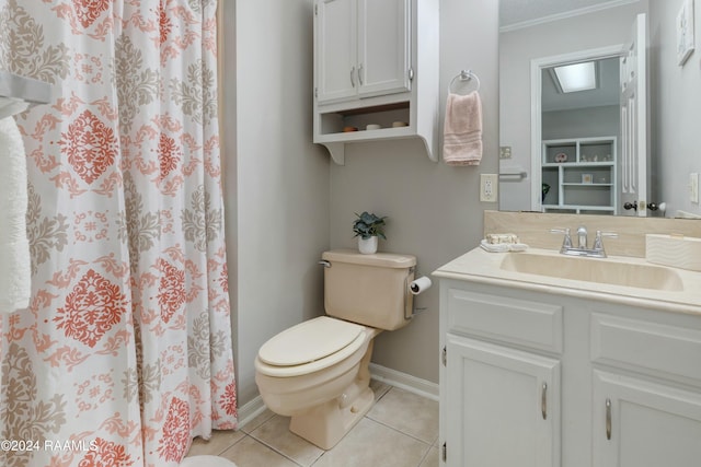 bathroom with toilet, vanity, tile patterned floors, and a shower with shower curtain