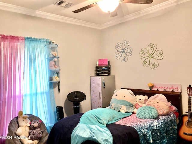 bedroom featuring ceiling fan and crown molding