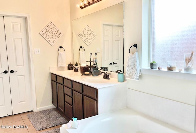 bathroom featuring tile patterned flooring and vanity