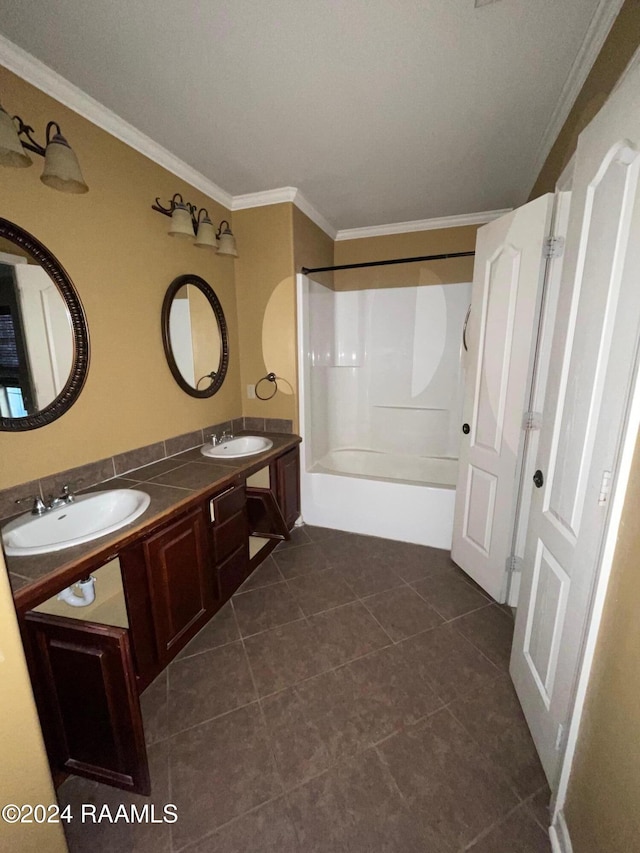 bathroom with tile patterned flooring, shower / bathing tub combination, vanity, and crown molding