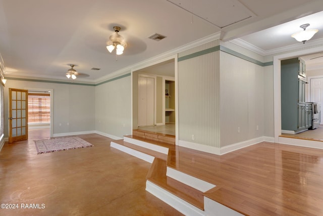 unfurnished room with ceiling fan, hardwood / wood-style floors, and crown molding