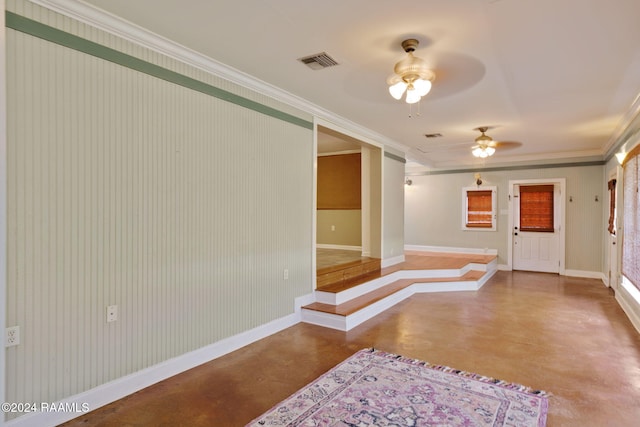 interior space featuring concrete flooring and ornamental molding