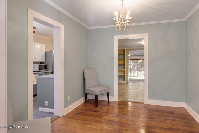 103 Brookside Dr, Lafayette, LA 70506 - sitting room featuring a chandelier, crown molding, and wood finished floors