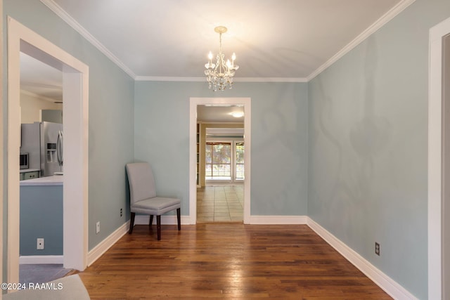 living area with dark hardwood / wood-style flooring, crown molding, and a chandelier