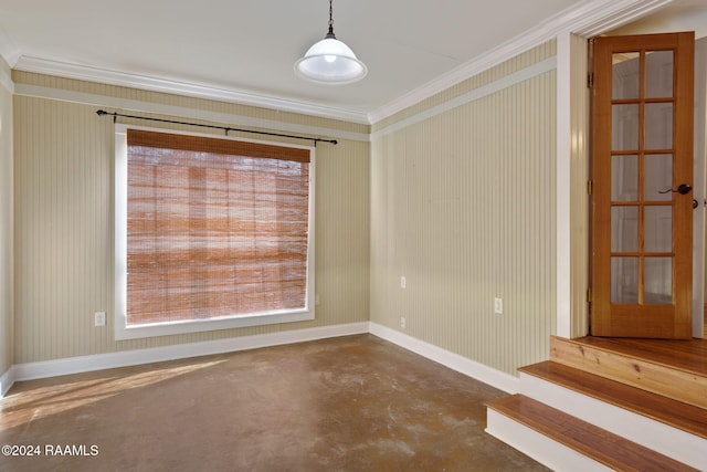 unfurnished room featuring crown molding