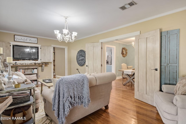 103 Brookside Dr, Lafayette, LA 70506 - living area featuring a chandelier, crown molding, and wood finished floors