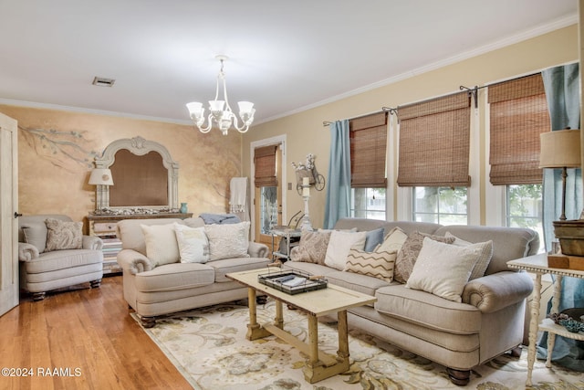 living room featuring a chandelier, crown molding, and wood-type flooring