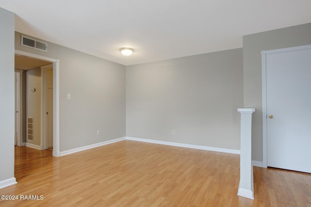 spare room featuring light hardwood / wood-style floors