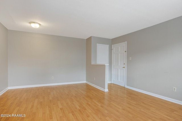 spare room featuring light hardwood / wood-style flooring