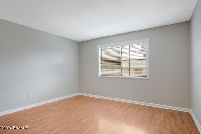 unfurnished room with light hardwood / wood-style flooring