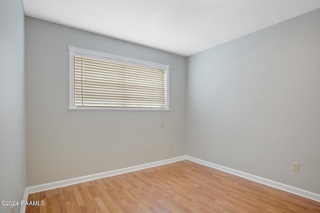 unfurnished room featuring light hardwood / wood-style flooring