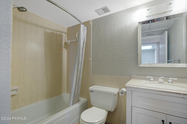 full bathroom featuring shower / bath combination with curtain, vanity, and toilet