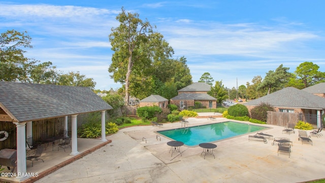 view of swimming pool with a gazebo and a patio