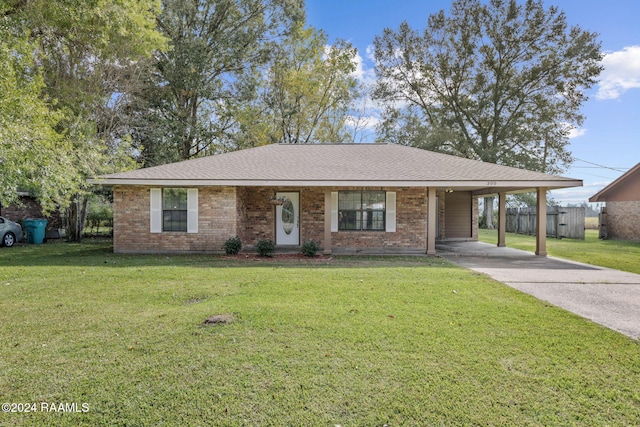 ranch-style home with a front lawn and a carport