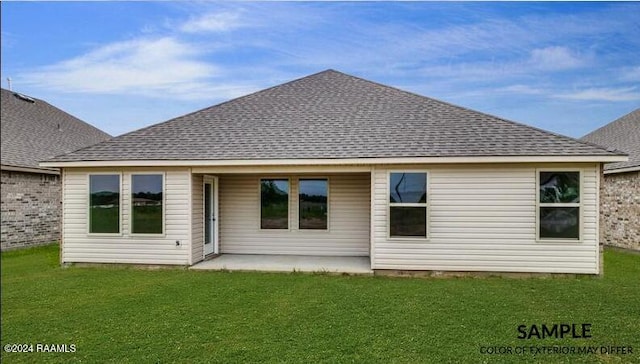 back of property featuring a lawn and a patio area