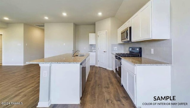 kitchen with a center island with sink, sink, white cabinetry, and stainless steel appliances