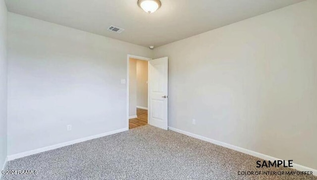 unfurnished room featuring carpet flooring