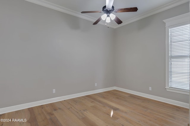 unfurnished room featuring a wealth of natural light, crown molding, ceiling fan, and light hardwood / wood-style flooring