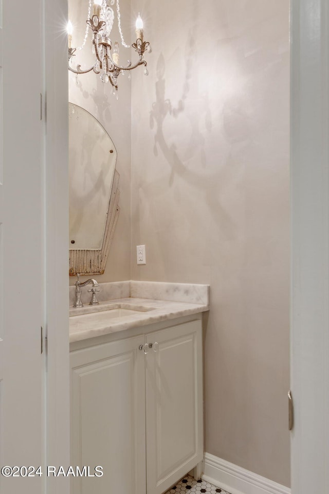 bathroom featuring vanity and a chandelier