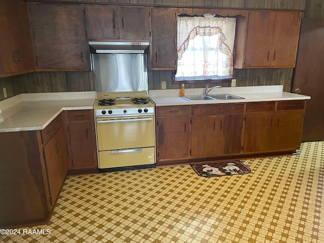 kitchen with extractor fan, sink, and stainless steel range