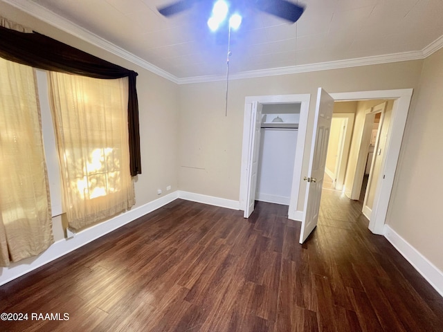 unfurnished bedroom with ceiling fan, dark hardwood / wood-style flooring, and ornamental molding