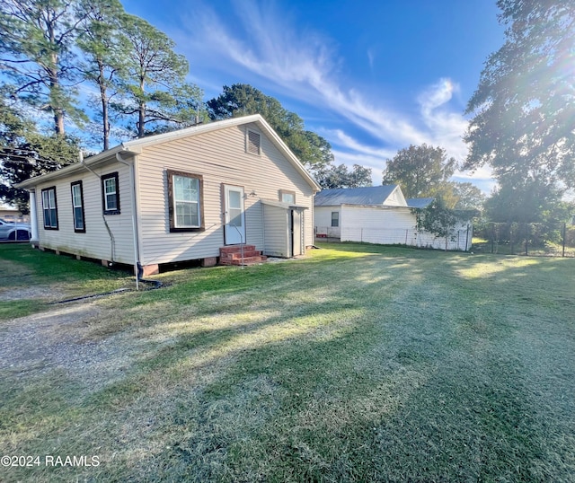 back of property with a yard