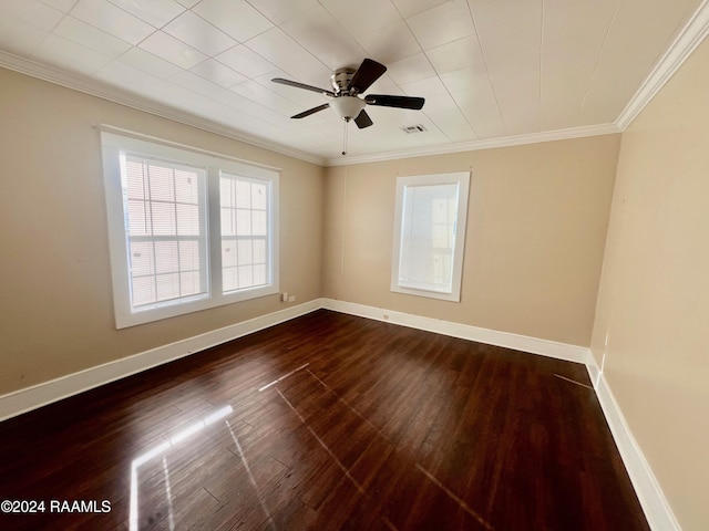 empty room featuring wood-type flooring, ceiling fan, and crown molding