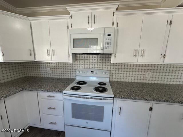 kitchen with white cabinets, white appliances, and crown molding