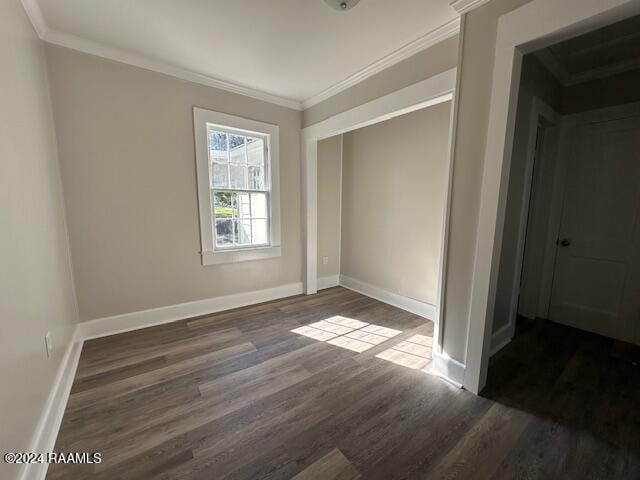 1722 Michael St, Abbeville, LA 70510 - unfurnished bedroom featuring wood finished floors, crown molding, and a closet