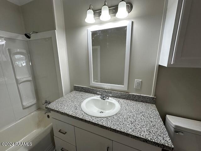 full bathroom featuring shower / tub combination, vanity, and toilet