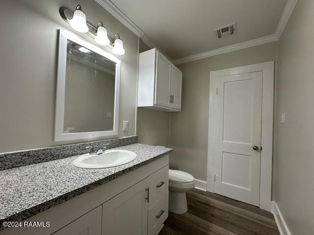 1722 Michael St, Abbeville, LA 70510 - bathroom featuring vanity, crown molding, and wood finished floors
