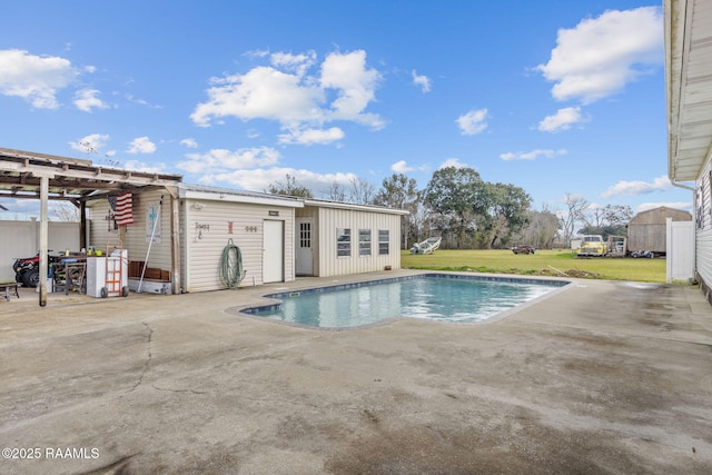 view of pool featuring a yard and a patio