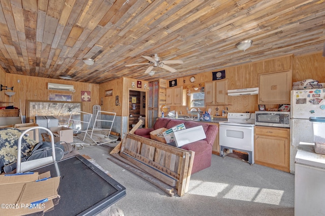 kitchen featuring white appliances, wood ceiling, light colored carpet, ceiling fan, and wooden walls