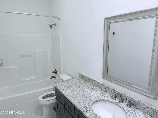 full bathroom with tile patterned floors, vanity,  shower combination, and toilet