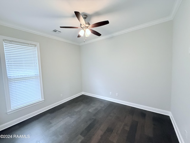 empty room with dark hardwood / wood-style floors, ceiling fan, and crown molding