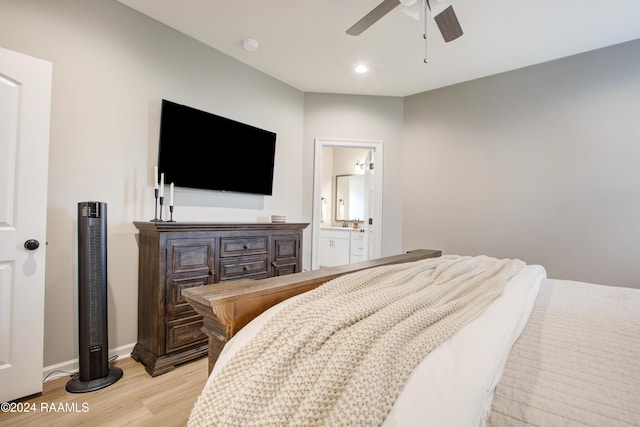 bedroom featuring connected bathroom, ceiling fan, and light wood-type flooring