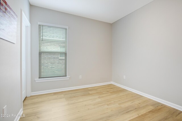 unfurnished room with light hardwood / wood-style floors