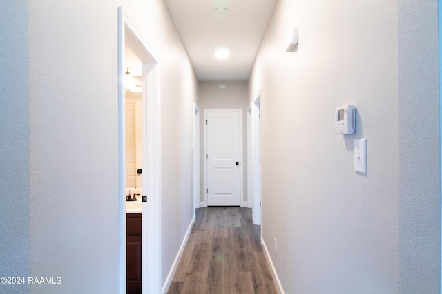 hallway featuring hardwood / wood-style flooring