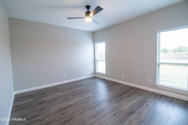 unfurnished room featuring dark hardwood / wood-style floors and ceiling fan