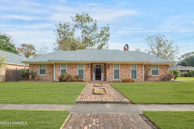 single story home with a front yard