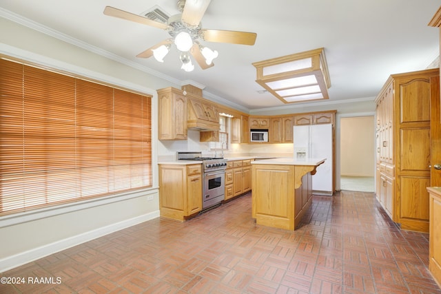 kitchen featuring built in microwave, crown molding, high end stainless steel range, a kitchen island, and white fridge with ice dispenser