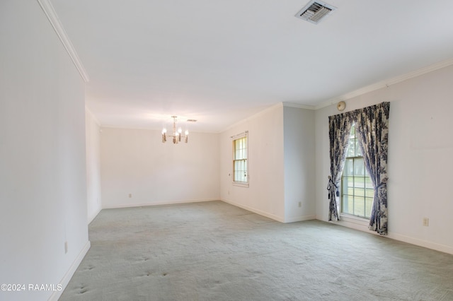 unfurnished room featuring crown molding, light colored carpet, and an inviting chandelier