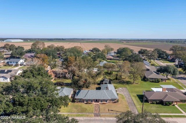 birds eye view of property with a rural view