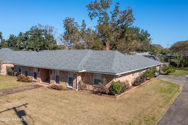 single story home featuring a front yard