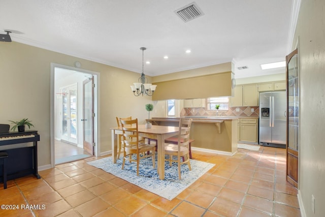 tiled dining space featuring a notable chandelier and crown molding