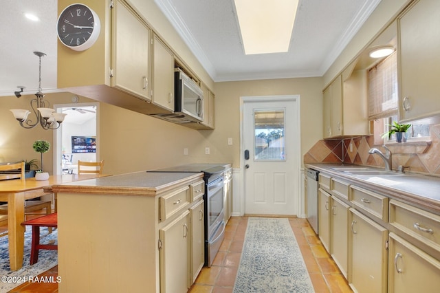 kitchen with a healthy amount of sunlight, cream cabinets, a chandelier, and appliances with stainless steel finishes