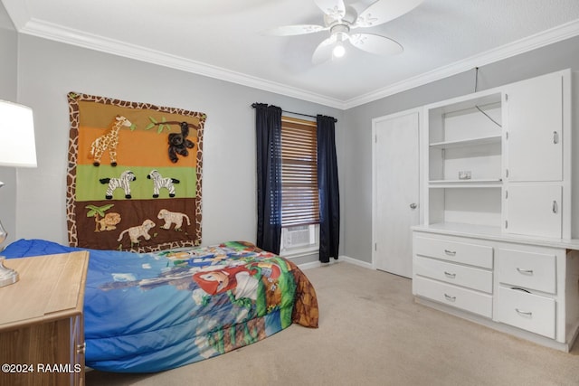 carpeted bedroom featuring ceiling fan and crown molding