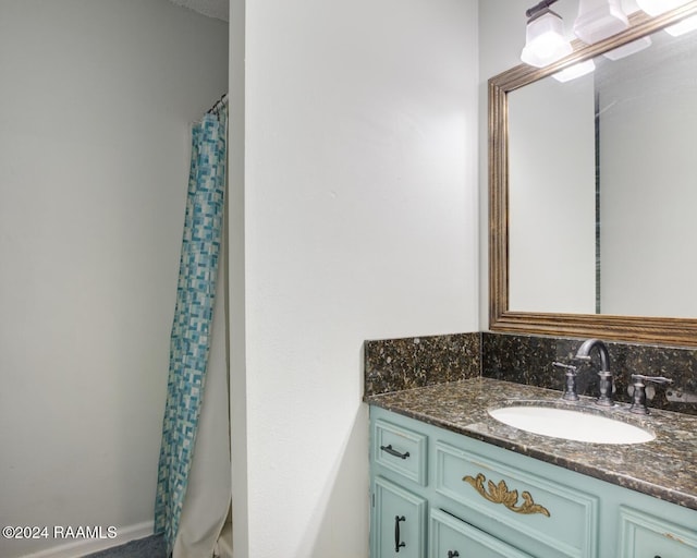 bathroom with vanity and walk in shower